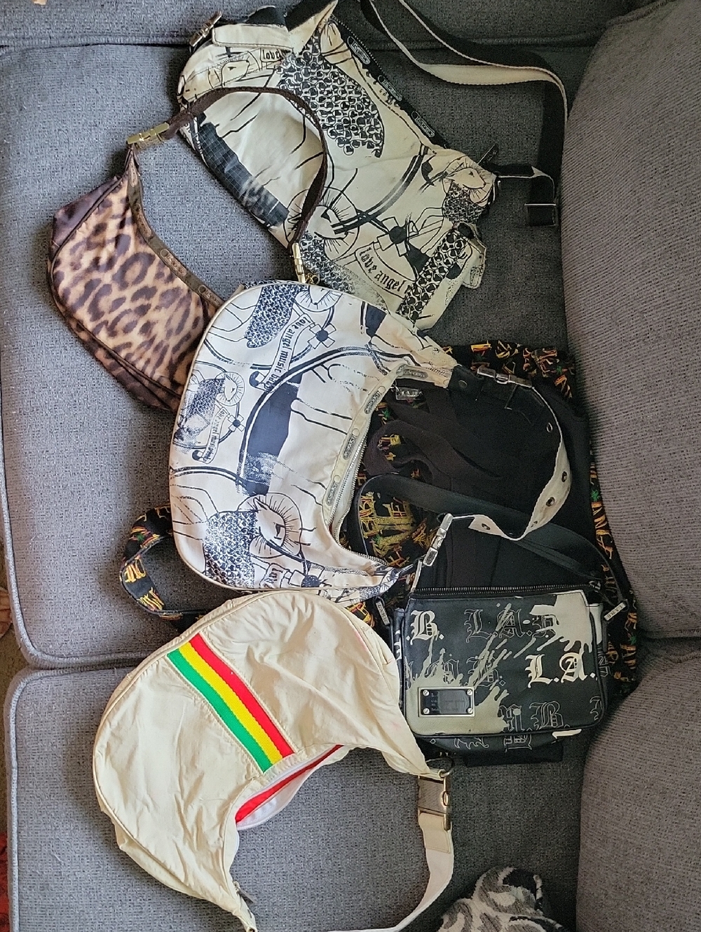 Assorted L.A.M.B. Crossbody Bags with Graphic Prints and Rasta Stripe